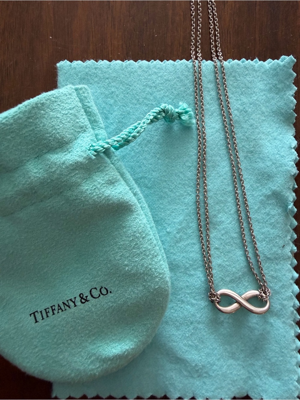 Tiffany & Co. Silver Infinity Necklace with Tiffany Blue Pouch